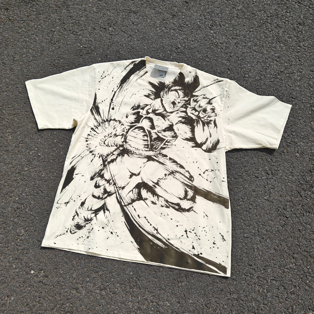 Acid-wash oversized all-over-print tee with Goku anime graphic print.