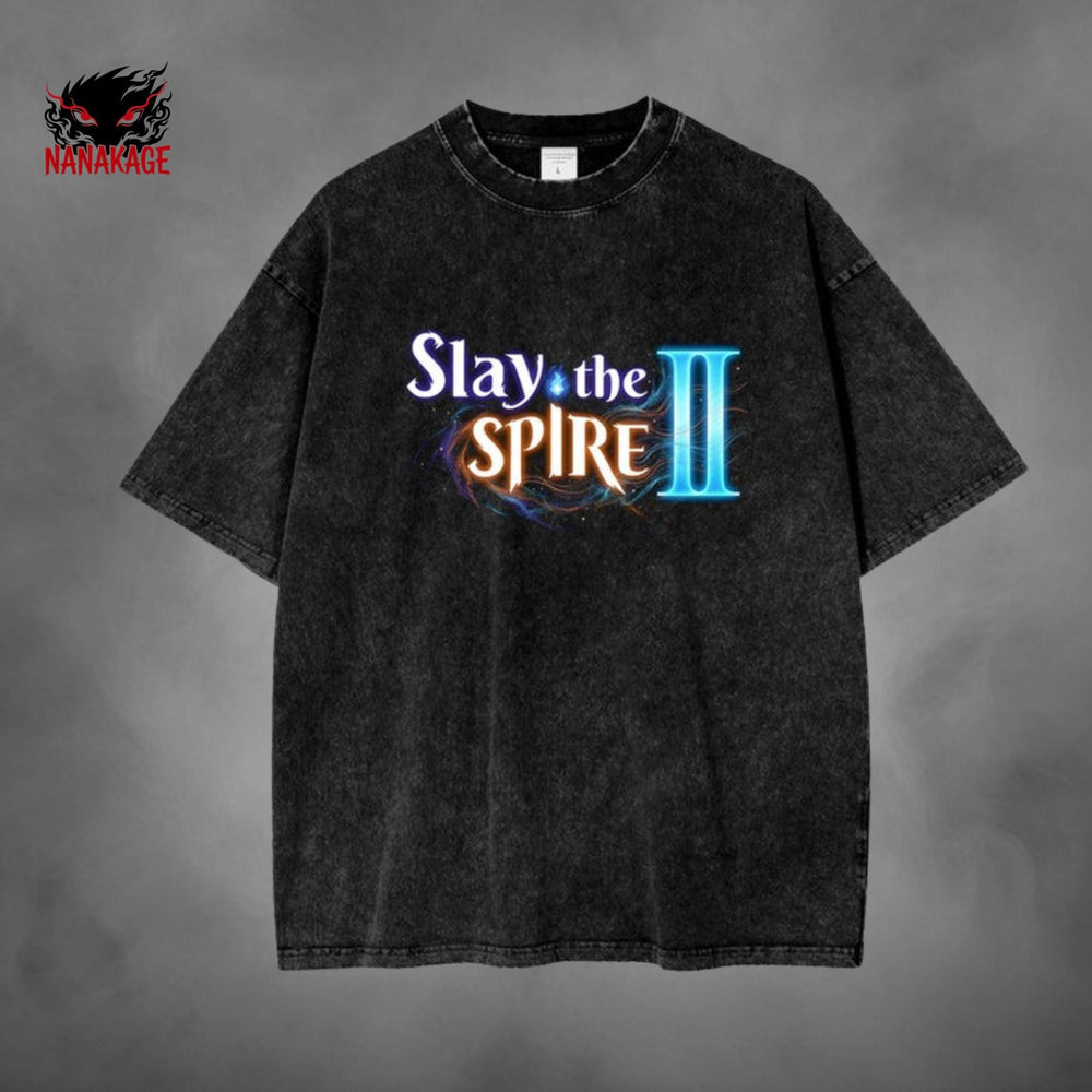 Black acid-wash oversized t-shirt with Slay The Spire indie game graphic print.