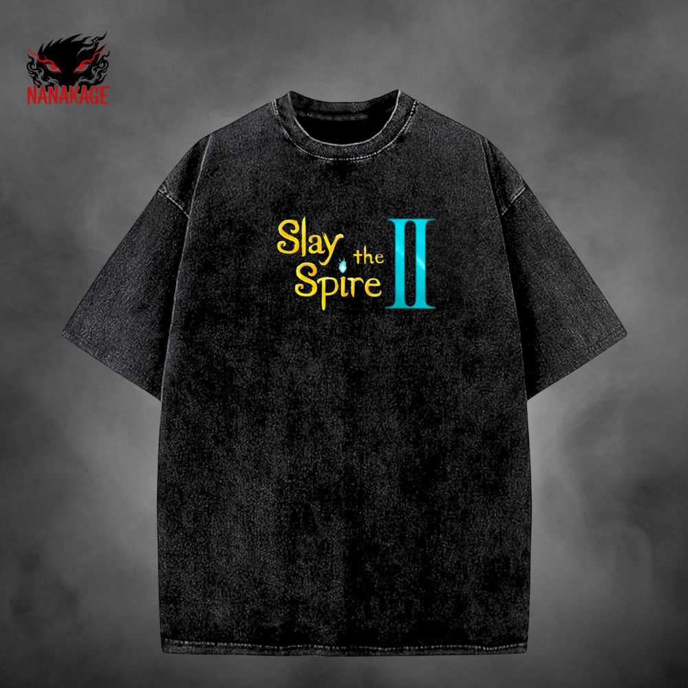 Black acid-wash oversized t-shirt with Slay The Spire indie game graphic print.