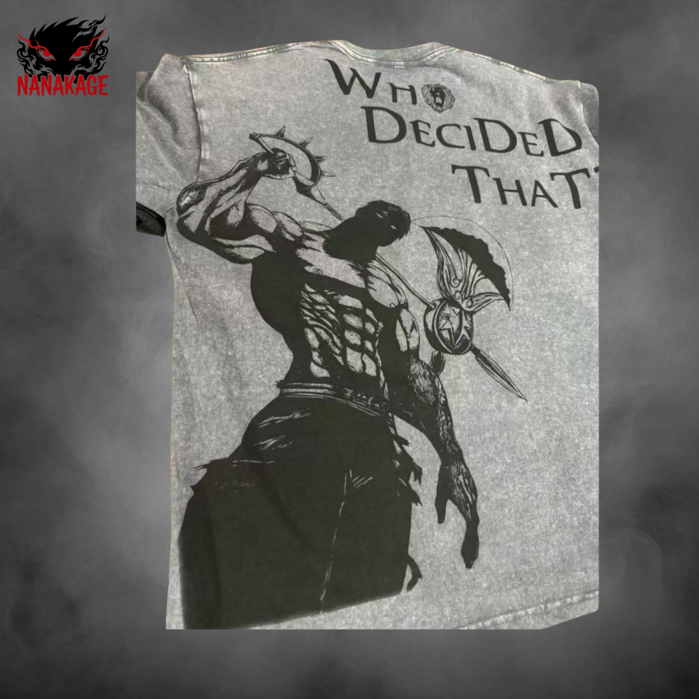 Gray t-shirt with black graphic of a muscular figure and 'Who Decided That?' text, brand 'NANAKAGE' visible.
