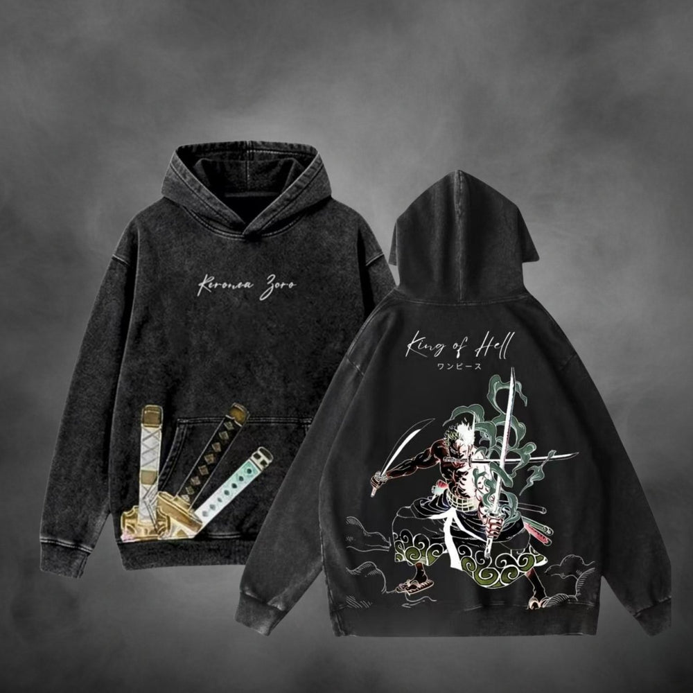 Black acid-wash oversized pullover hoodie with Roronoa Zoro King of Hell One Piece anime graphic print.