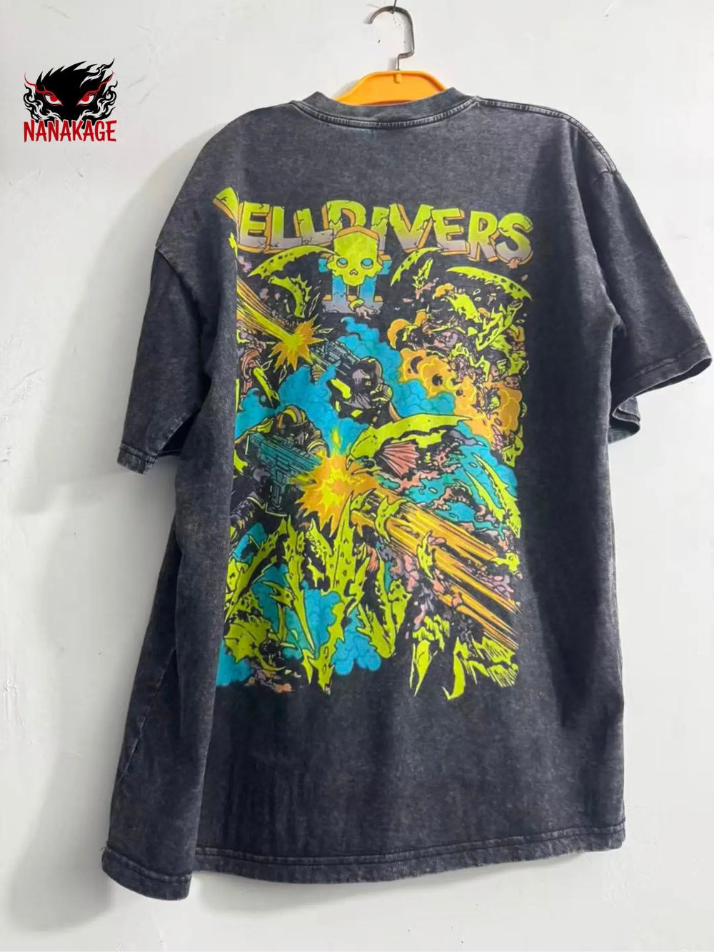 Black acid-wash oversized t-shirt with Helldivers streetwear graphic print.