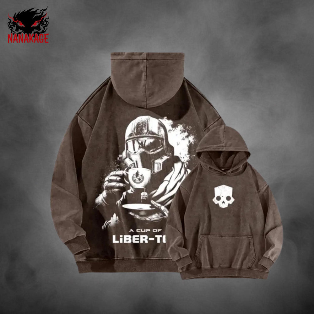 Black acid-wash oversized pullover hoodie with Helldivers video game graphic print.