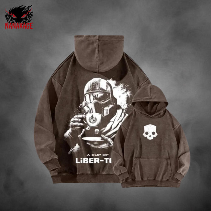 Black acid-wash oversized pullover hoodie with Helldivers video game graphic print.