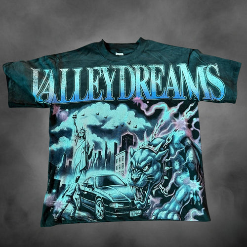 Teal oversized streetwear t-shirt with Valley Dreams NYC panther car city graphic print.