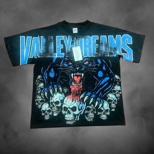 Black oversized streetwear t-shirt with Valley Dreams panther skulls dark graphic print.
