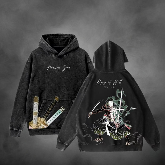 Black acid-wash oversized pullover hoodie with Roronoa Zoro King of Hell One Piece anime graphic print.